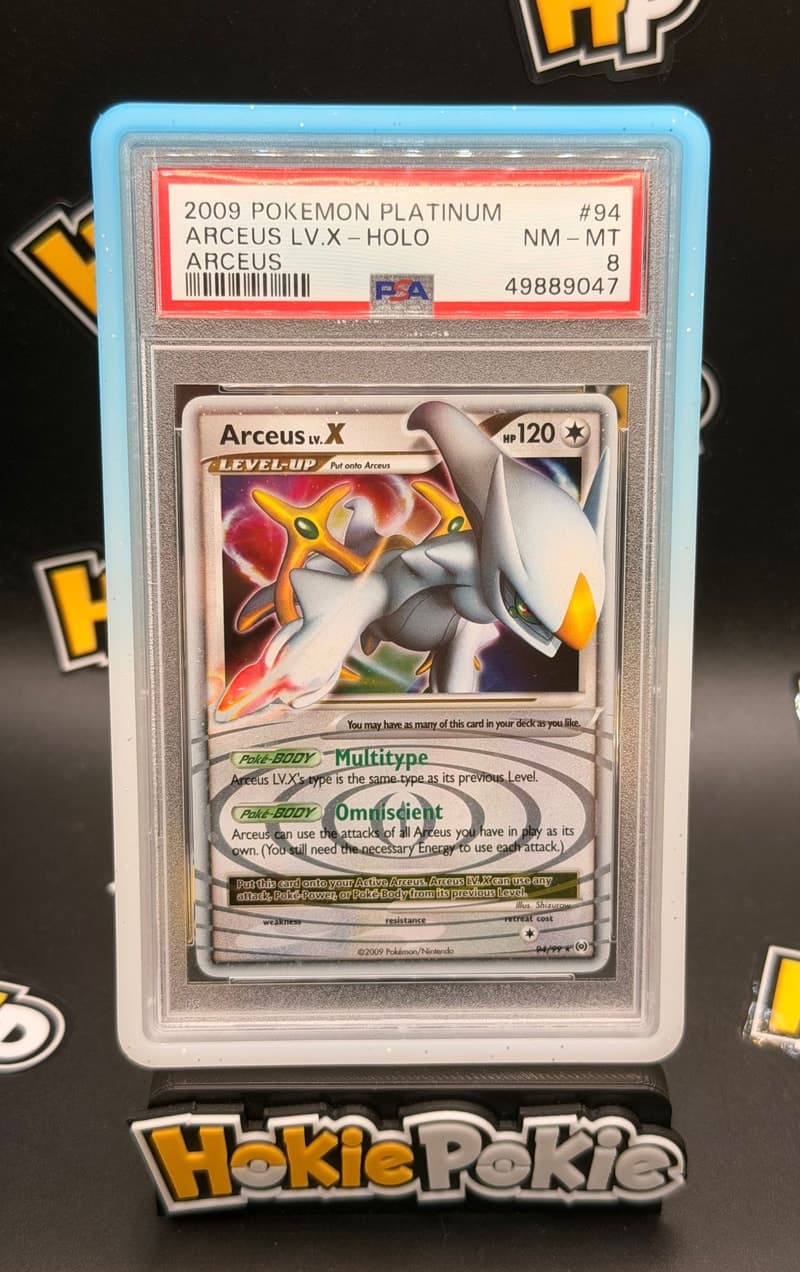 Arceus LV.X, PSA 8 graded, card 94 of 99 from the 2009 Arceus Pokémon TCG set. Actual photo of the card in hand.
