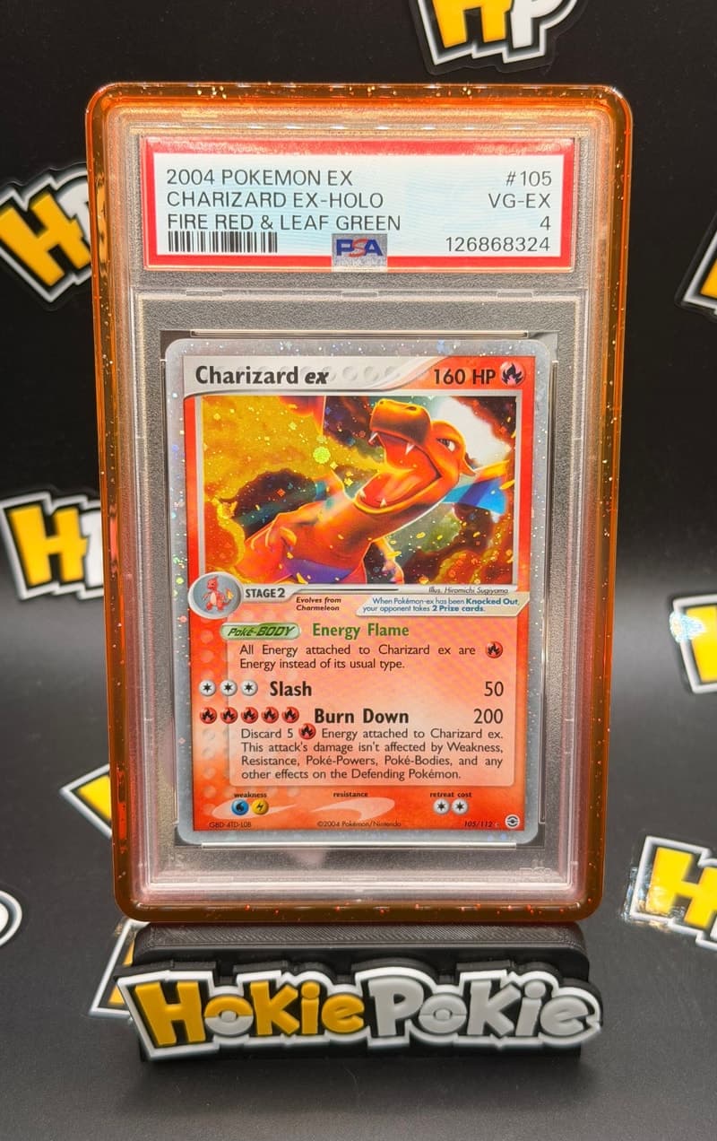 Charizard ex, PSA 4 graded, card 105 of 112 from the 2004 EX FireRed & LeafGreen Pokémon TCG set. Actual photo of the card in hand.