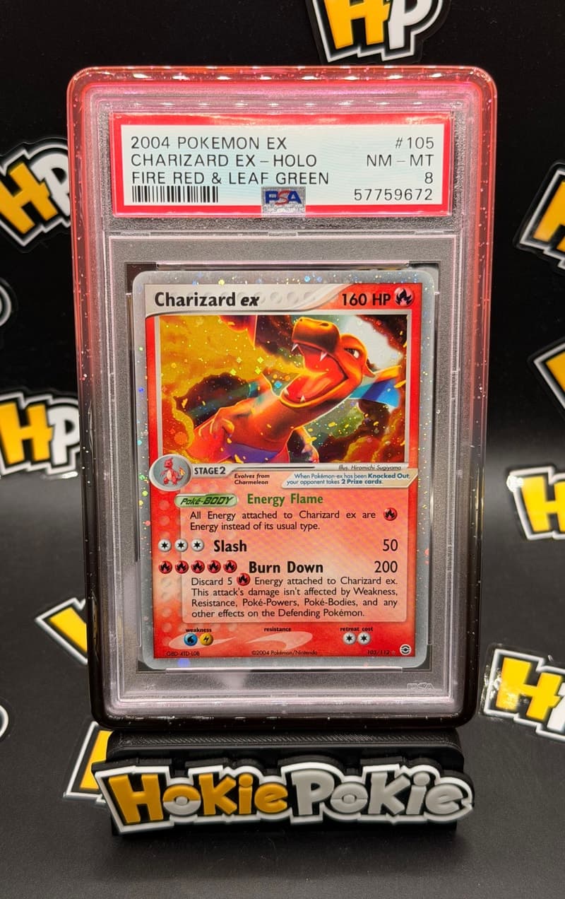 Charizard ex, PSA 8 graded, card 105 of 112 from the 2004 EX FireRed & LeafGreen Pokémon TCG set. Actual photo of the card in hand.