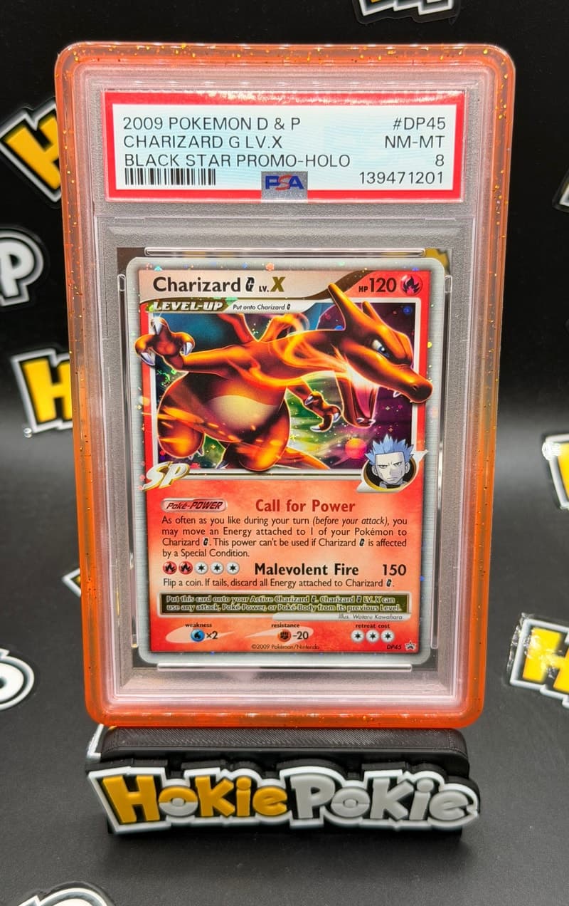 Charizard G LV.X, PSA 8 graded, card DP45 from the 2009 DP Black Star Promos Pokémon TCG set. Actual photo of the card in hand.