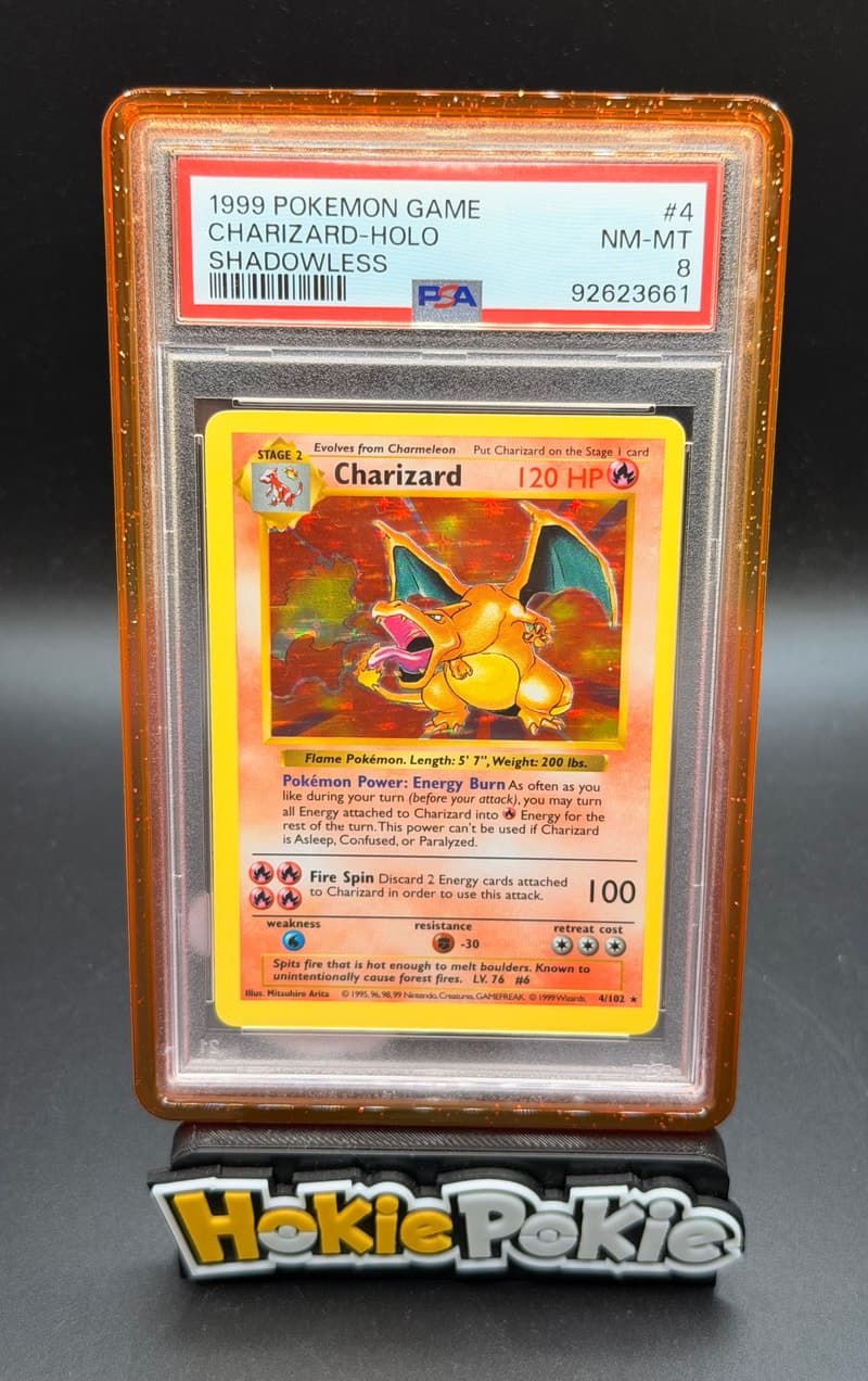 Charizard, PSA 8 graded, card 4 of 102 from the 1999 Base Set Pokémon TCG set.