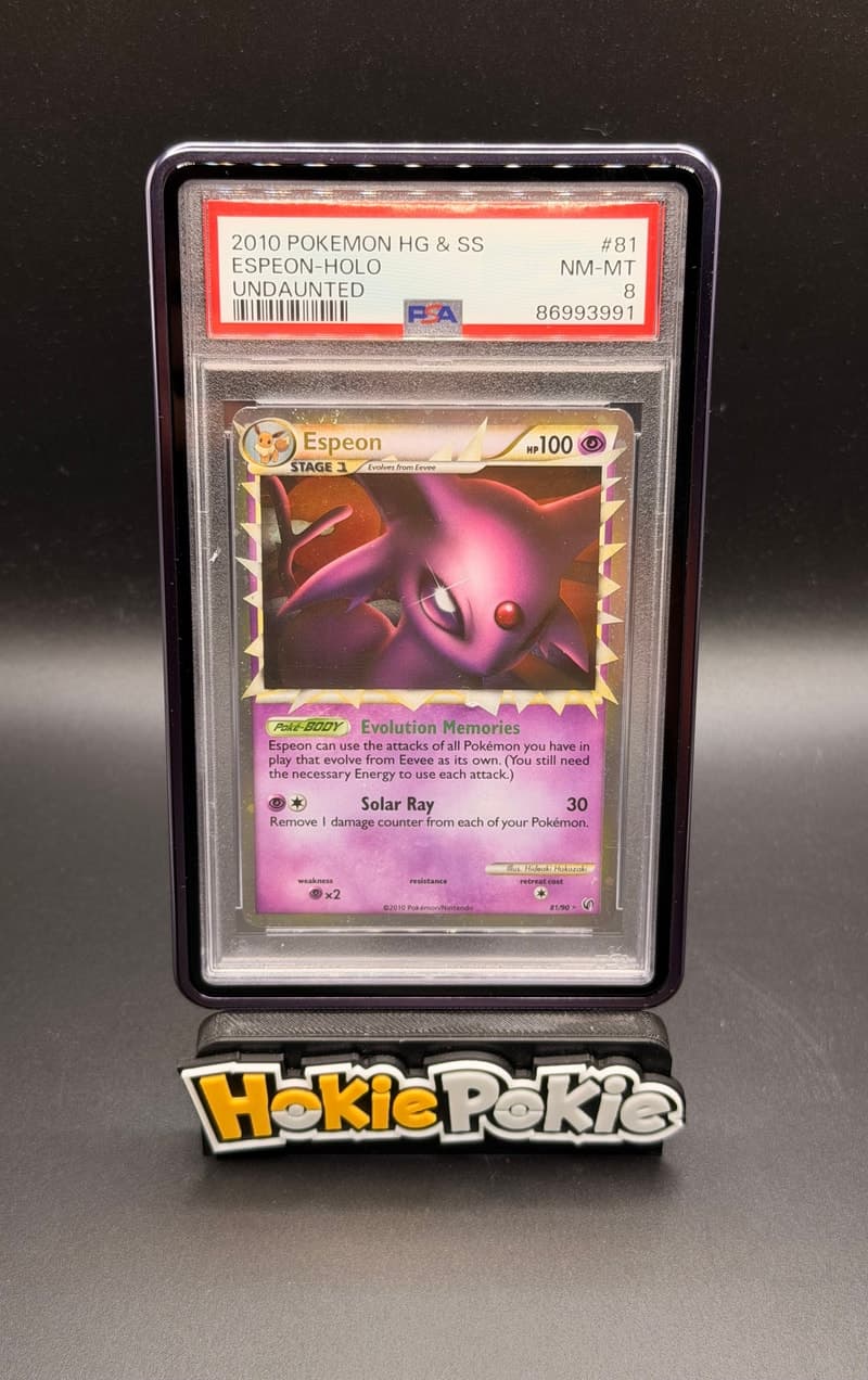 Espeon Prime, PSA 8 graded, card 81 of 90 from the 2010 HS Undaunted Pokémon TCG set.