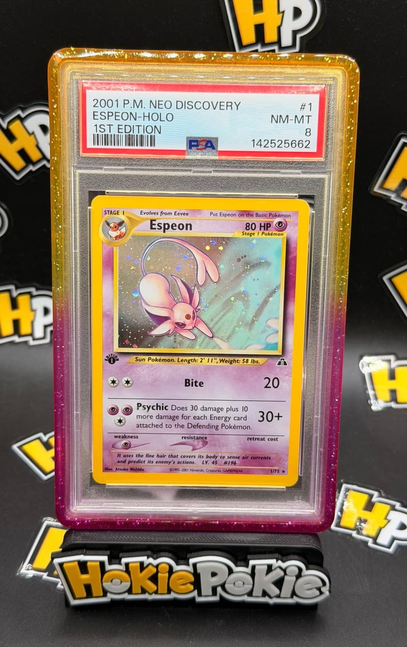 Espeon, PSA 8 graded, card 1 of 75 from the 2001 Neo Discovery Pokémon TCG set.
