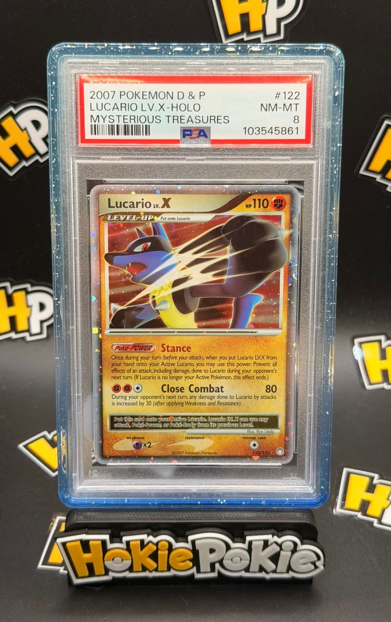 Lucario LV.X, PSA 8 graded, card 122 of 123 from the 2007 Mysterious Treasures Pokémon TCG set. Actual photo of the card in hand.