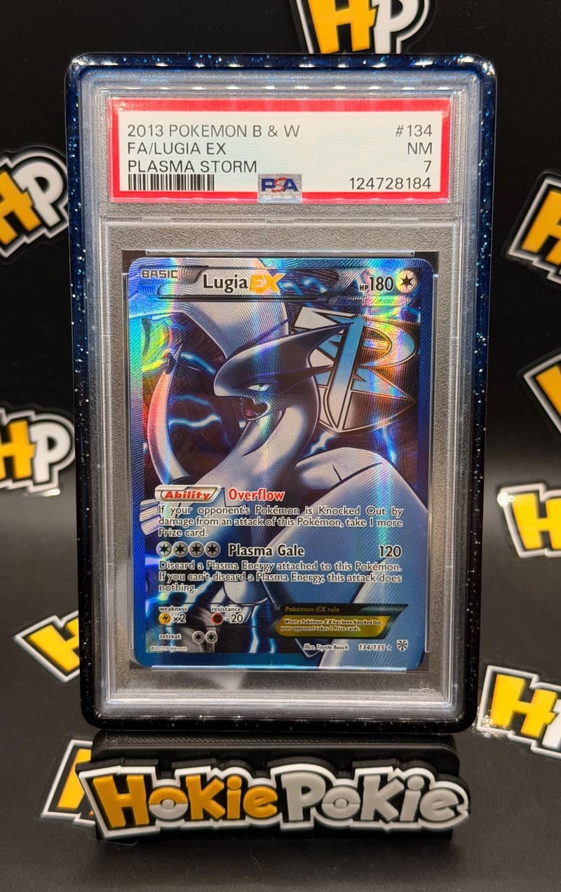Lugia EX, PSA 7 graded, card 134 of 135 from the 2013 Plasma Storm Pokémon TCG set. Actual photo of the card in hand.