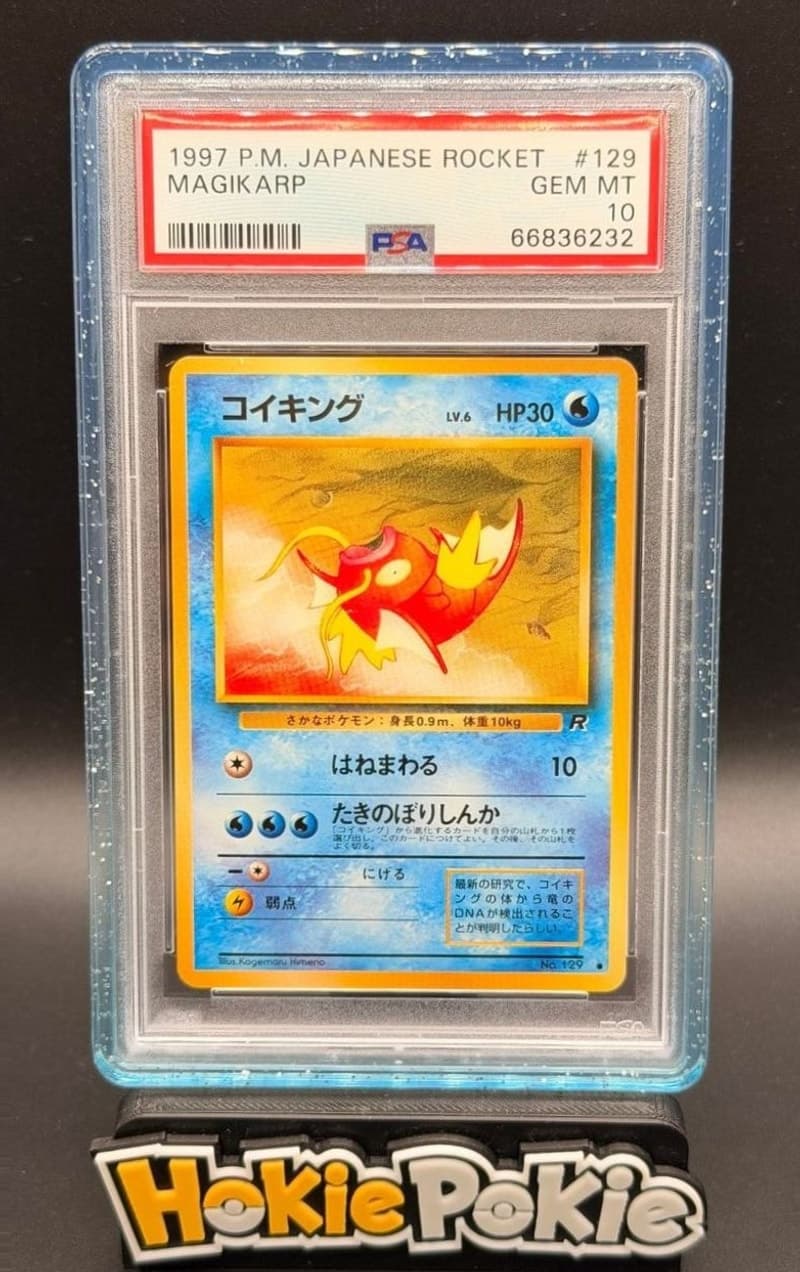 Magikarp, PSA 10 graded, card 129 from the 1997 Team Rocket (Japanese) Pokémon TCG set. Actual photo of the card in hand.