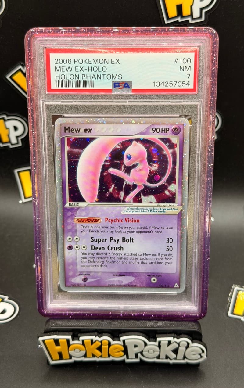 Mew ex, PSA 7 graded, card 100 of 110 from the 2006 EX Holon Phantoms Pokémon TCG set.