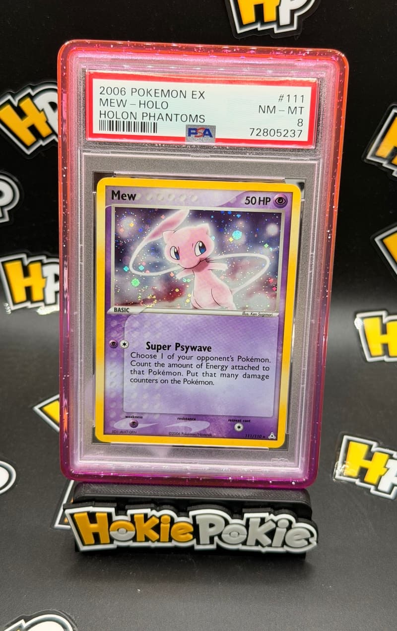 Mew, PSA 8 graded, card 111 of 110 from the 2006 EX Holon Phantoms Pokémon TCG set.