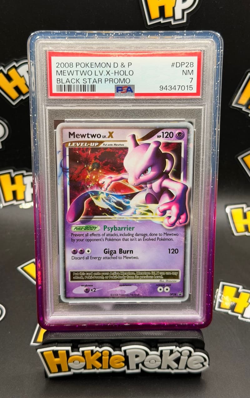 Mewtwo LV.X, PSA 7 graded, card DP28 from the 2008 DP Black Star Promos Pokémon TCG set. Actual photo of the card in hand.