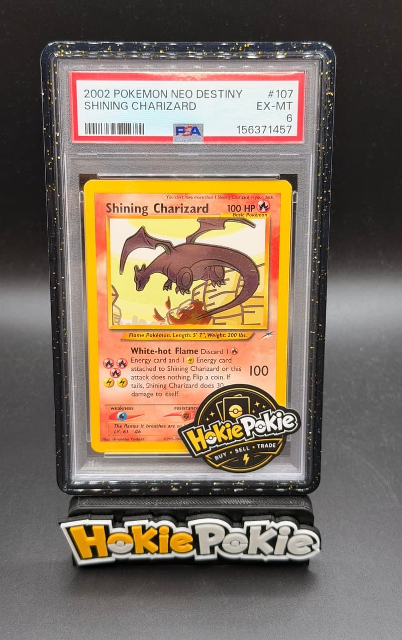 Shining Charizard, PSA 6 graded, card 107 of 105 from the 2002 Neo Destiny Pokémon TCG set.