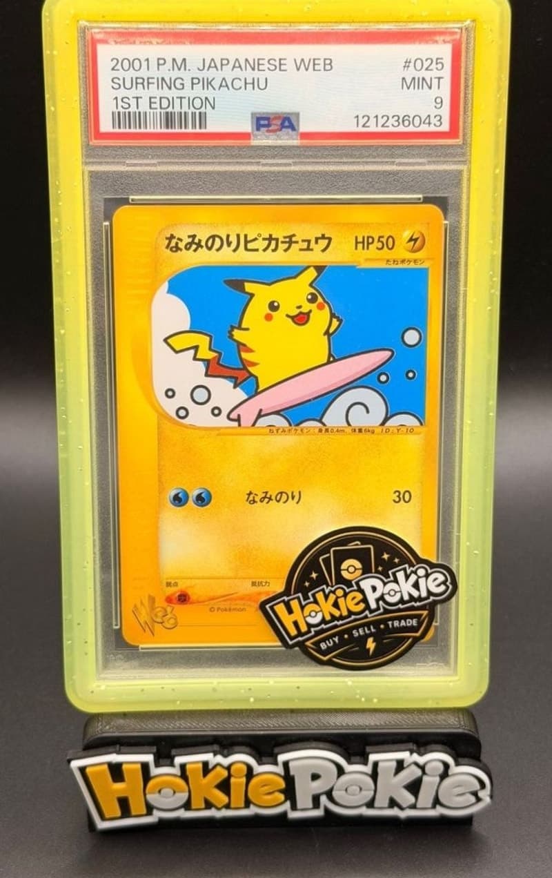 Surfing Pikachu, PSA 9 graded, card 25 of 48 from the 2001 Pokémon Web (Japanese) Pokémon TCG set. Actual photo of the card in hand.
