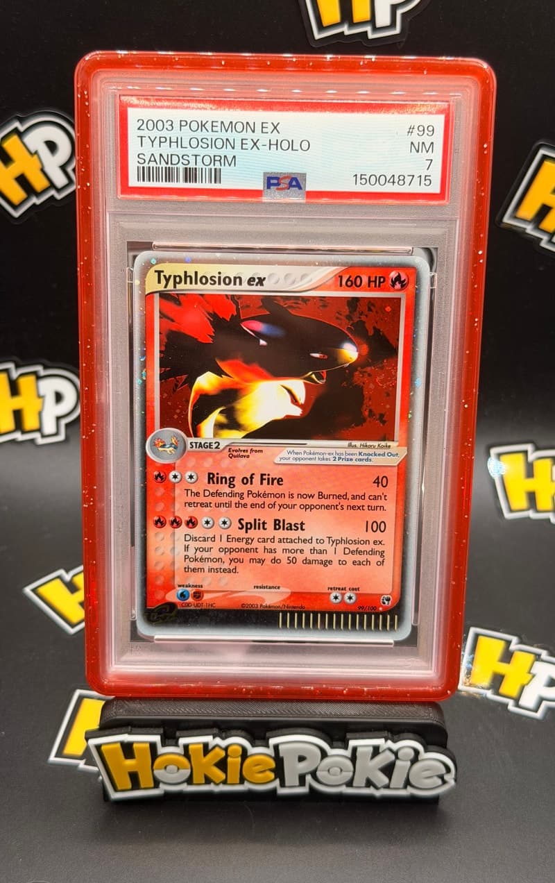 Typhlosion ex, PSA 7 graded, card 99 of 100 from the 2003 EX Sandstorm Pokémon TCG set.