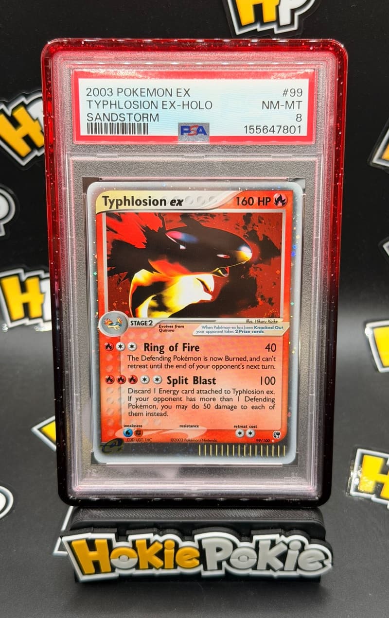 Typhlosion ex, PSA 8 graded, card 99 of 100 from the 2003 EX Sandstorm Pokémon TCG set. Actual photo of the card in hand.